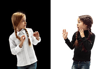 Image showing portrait of two scared girls on a white and black background