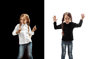 Image showing portrait of two emotional girls on a white and black background