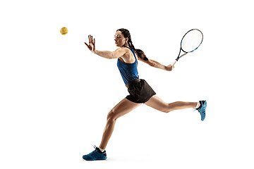 Image showing Full length portrait of young woman playing tennis isolated on white background