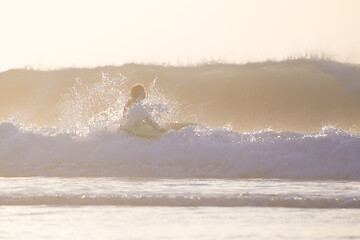 Image showing Body surfer riding a perfect wave.