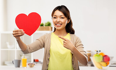 Image showing happy asian woman with red heart