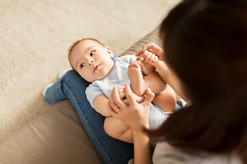 Image showing young mother with little asian baby son at home