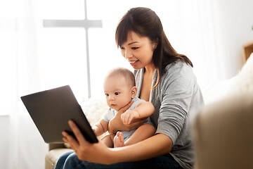 Image showing asian mother with baby son and tablet pc at home