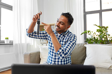 Image showing male blogger recording video review of smart watch