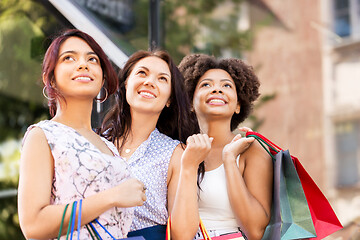 Image showing happy women with shopping bags in city