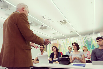 Image showing teacher with a group of students in classroom