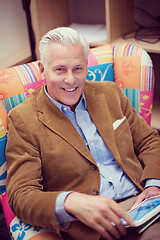 Image showing portrait of handsome teacher in colorful chair