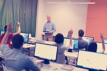Image showing teacher and students in computer lab classroom