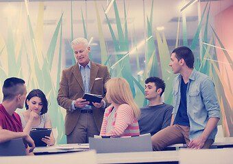 Image showing teacher with a group of students in classroom