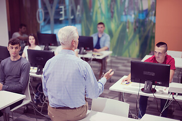 Image showing teacher and students in computer lab classroom