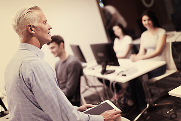 Image showing teacher and students in computer lab classroom