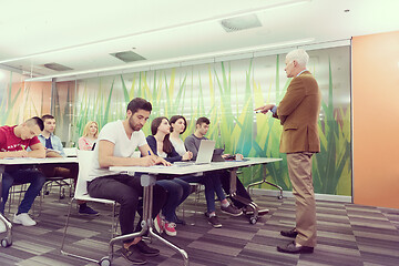 Image showing teacher with a group of students in classroom