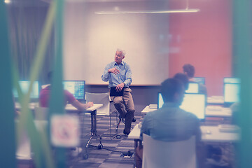 Image showing teacher and students in computer lab classroom