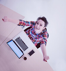 Image showing top view of young business woman working on laptop