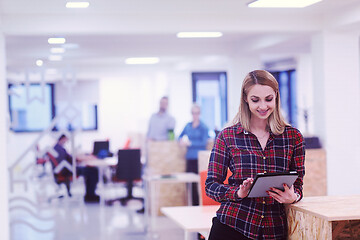 Image showing portrait of young business woman at office with team in backgrou