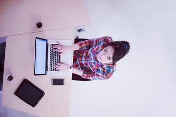 Image showing top view of young business woman working on laptop