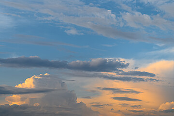 Image showing Blue, yellow and orange sunset with clouds