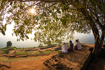 Image showing Group of unrecognizable tourists enjoying amazing view from mount Sigiriya, Sri Lanka, Ceylon. Sigiriya, Lion rock, is a large stone and ancient palace ruin in the central Sri Lanka