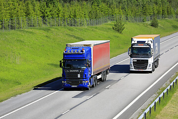 Image showing Truck Overtakes Another on Freeway