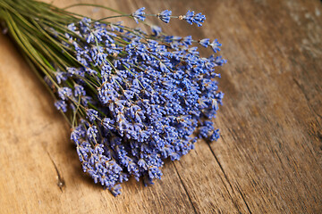 Image showing A bunch of lavender flowers on on stone surface