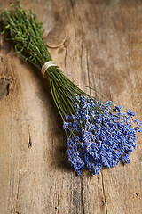 Image showing A bunch of lavender flowers on on stone surface