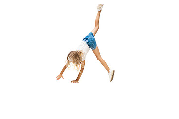 Image showing Happy little caucasian girl jumping and running isolated on white background