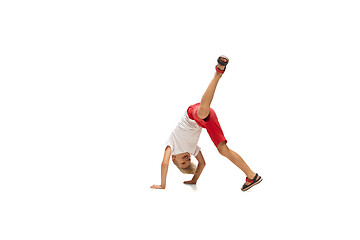 Image showing Happy little caucasian boy jumping and running isolated on white background