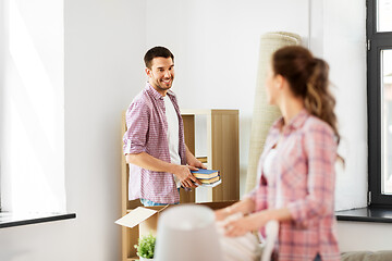 Image showing happy couple with stuff moving to new home