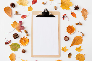 Image showing autumn fruits and clipboard with blank white paper