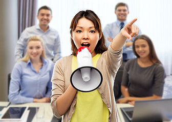 Image showing asian woman speaking to megaphone over office team