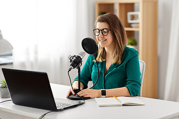 Image showing woman with microphone recording podcast at studio