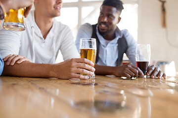 Image showing male friends drinking beer at bar or pub