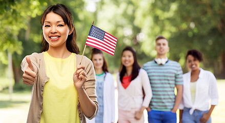 Image showing happy asian woman with american flag