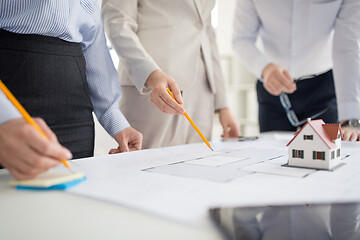 Image showing close up of architects discussing house project