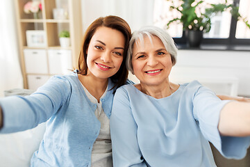 Image showing senior mother and adult daughter taking selfie