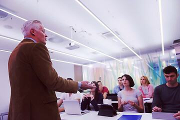 Image showing teacher with a group of students in classroom