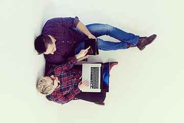 Image showing top view of  couple working on laptop computer at startup office