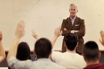 Image showing teacher with a group of students in classroom