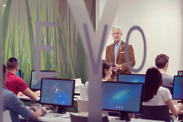 Image showing teacher and students in computer lab classroom