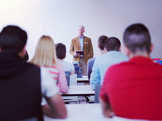 Image showing teacher with a group of students in classroom