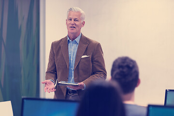 Image showing teacher and students in computer lab classroom