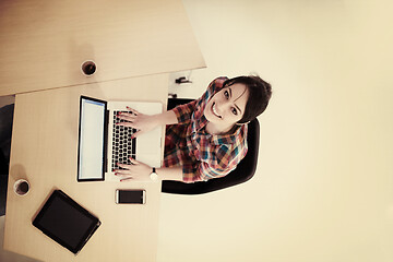 Image showing top view of young business woman working on laptop