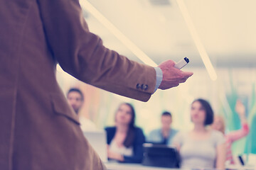 Image showing close up of teacher hand while teaching in classroom