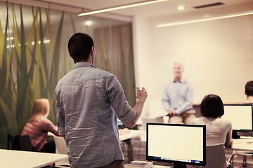 Image showing student answering a question in classroom