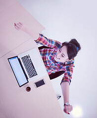 Image showing top view of young business woman working on laptop