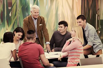 Image showing teacher with a group of students in classroom