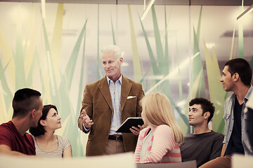 Image showing teacher with a group of students in classroom