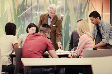 Image showing teacher with a group of students in classroom