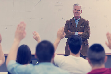 Image showing teacher with a group of students in classroom