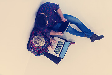 Image showing top view of  couple working on laptop computer at startup office